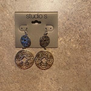Gold and silver dangling studio s earrings